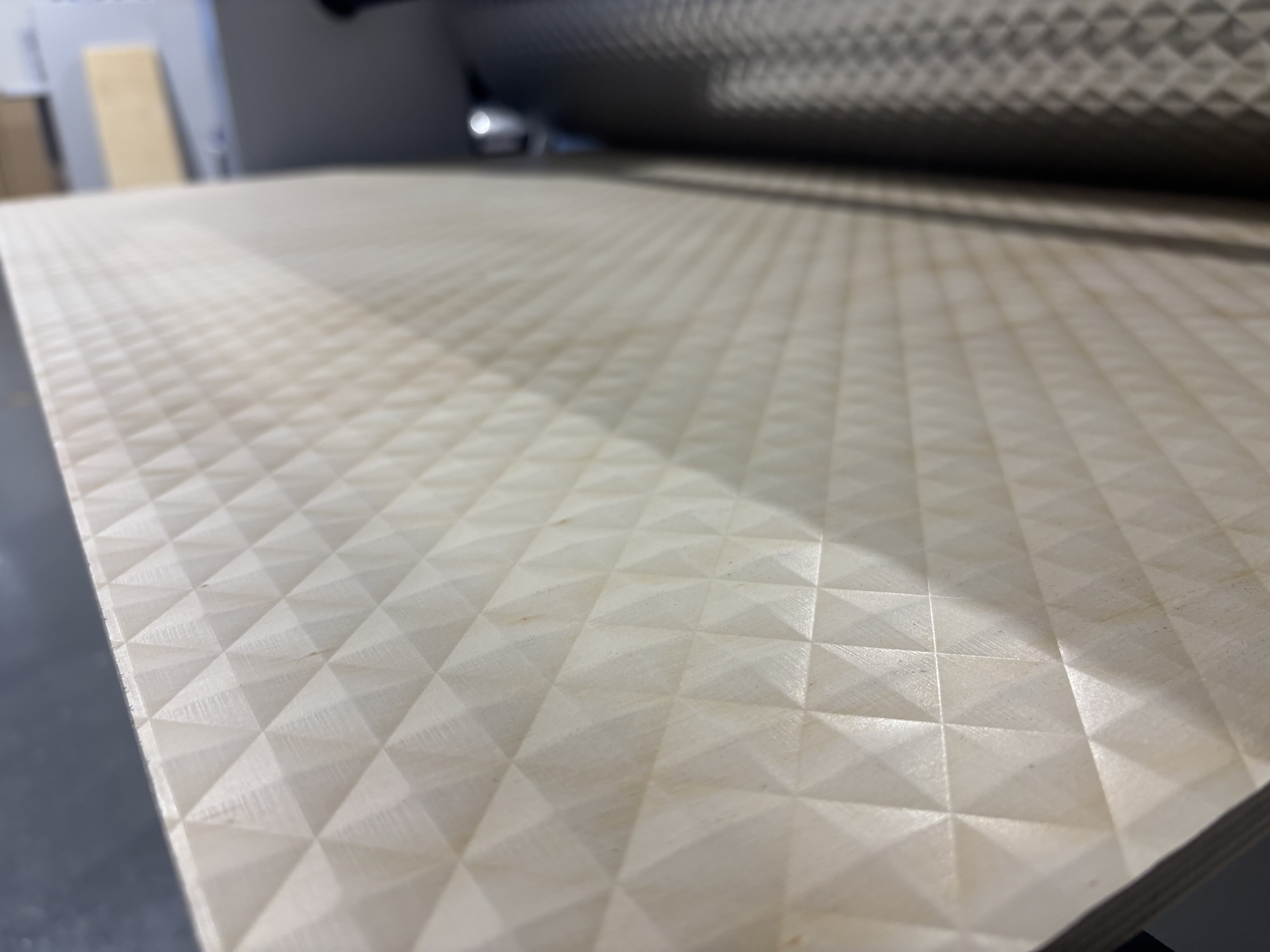 Diamond embossed panel fresh off the embossing roller